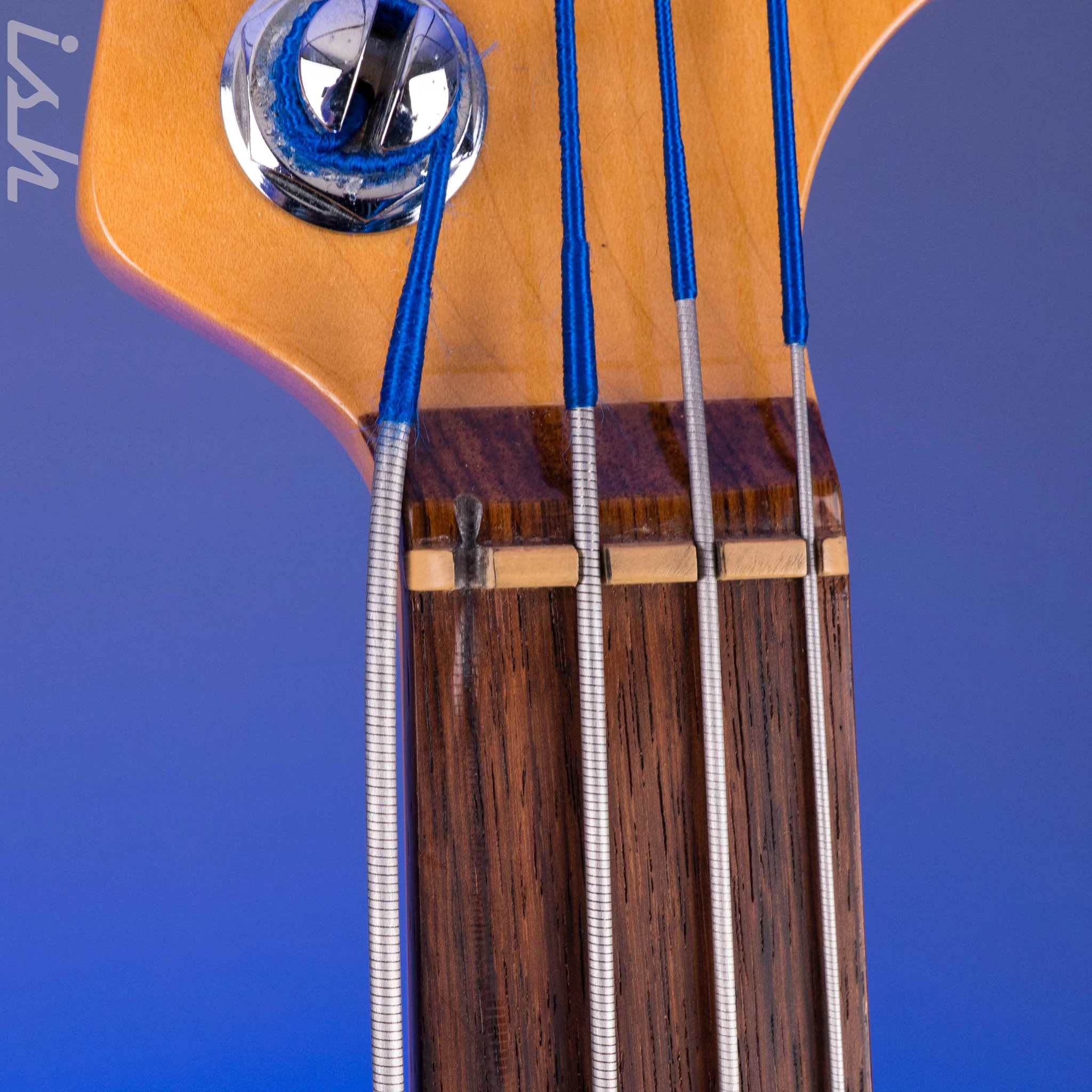 1999 Fender American Deluxe Jazz Bass Fretless 4-String Transparent Crimson Red - Image 11